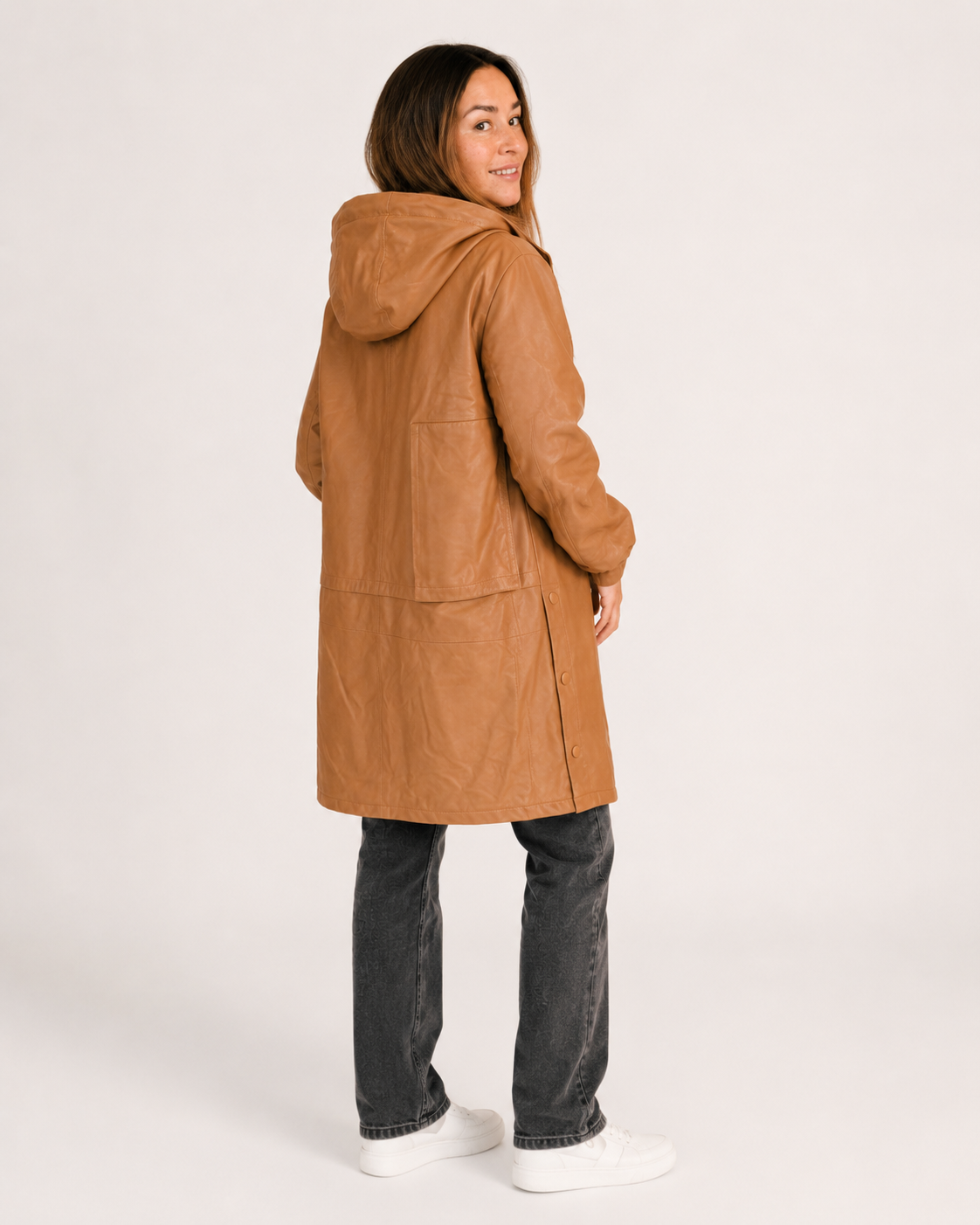 Women's tan hooded leather coat rear angle studio view